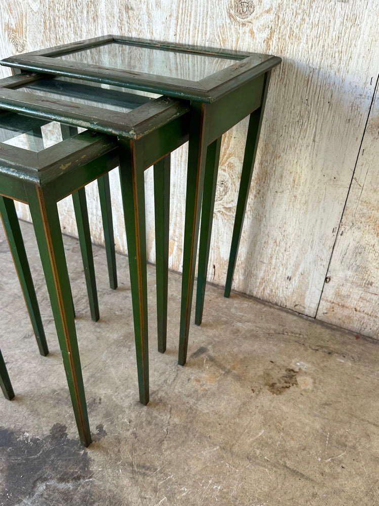 Vintage green lacquered nesting tables nested together, front angle with glass-inset tops