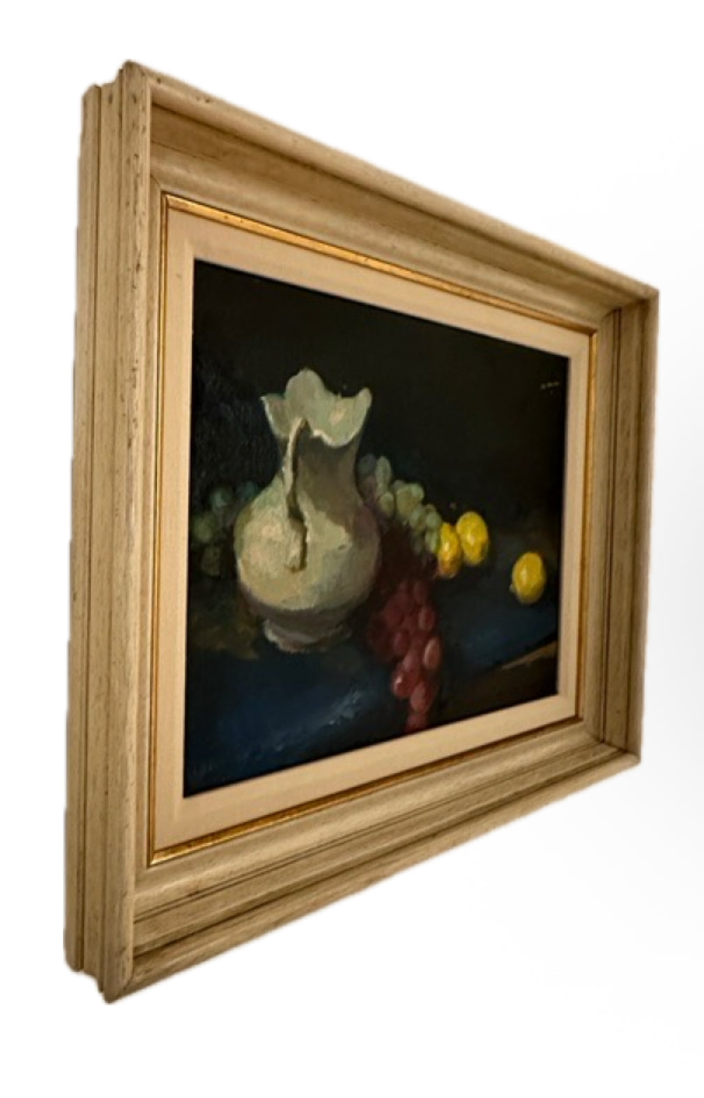 Vintage still life painting, angled three-quarter view showing the limed wood frame profile