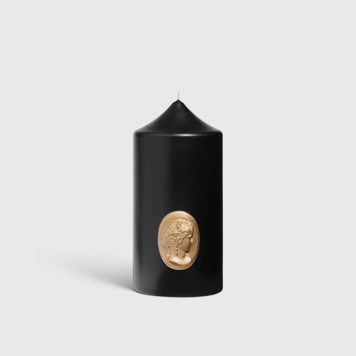 Trudon La Marquise black pillar candle with gold cameo profile medallion, front view