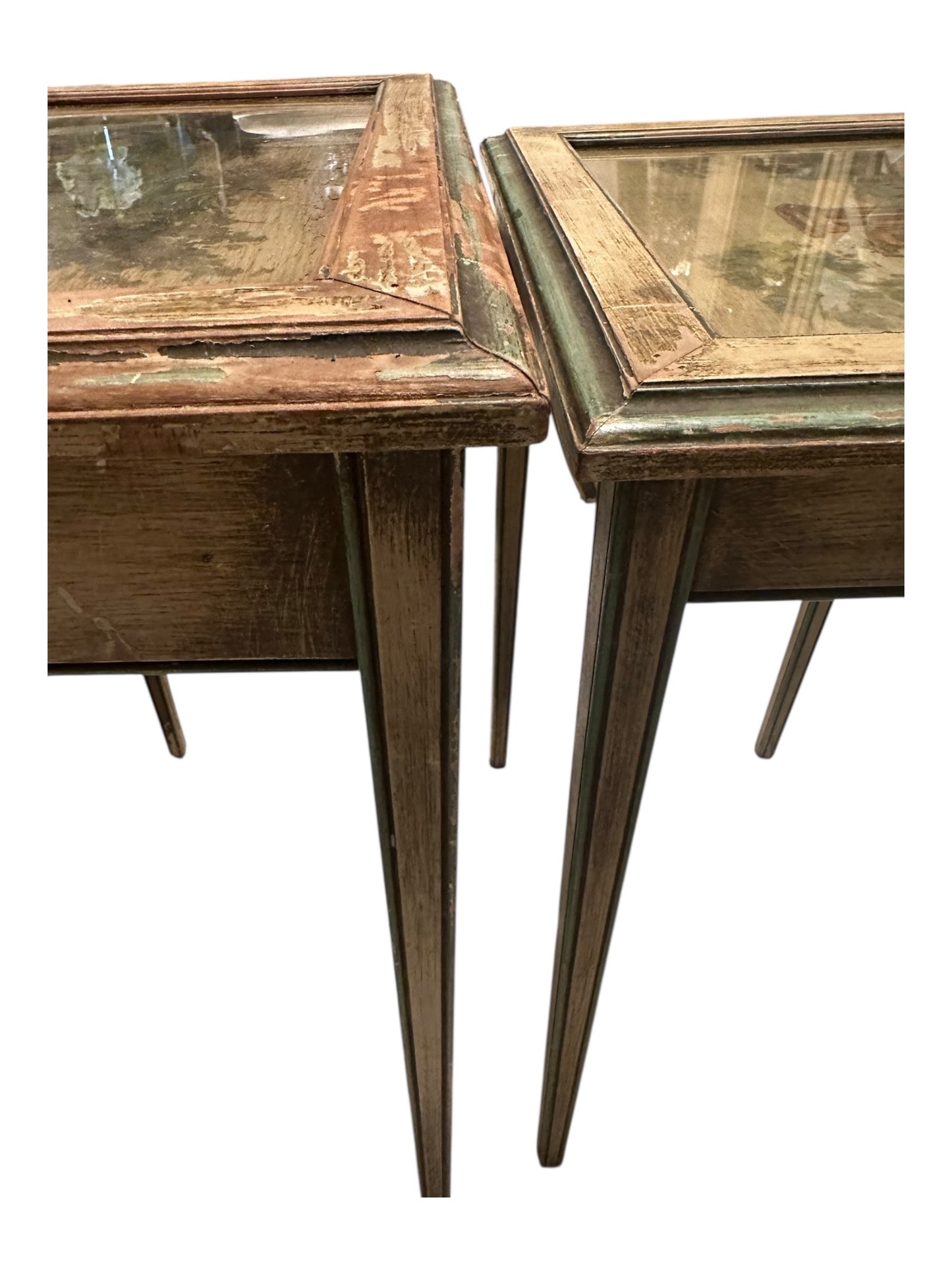 Side view of both nesting tables showing glass-covered tops and tapered legs.