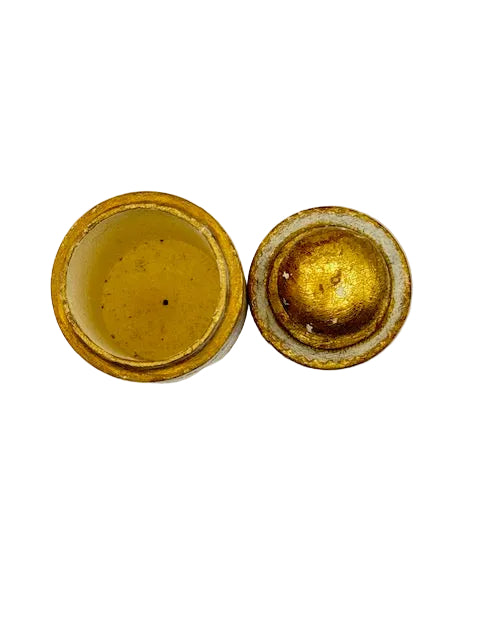 Top-down view of open Florentine canister showing gilt interior and underside of lid.