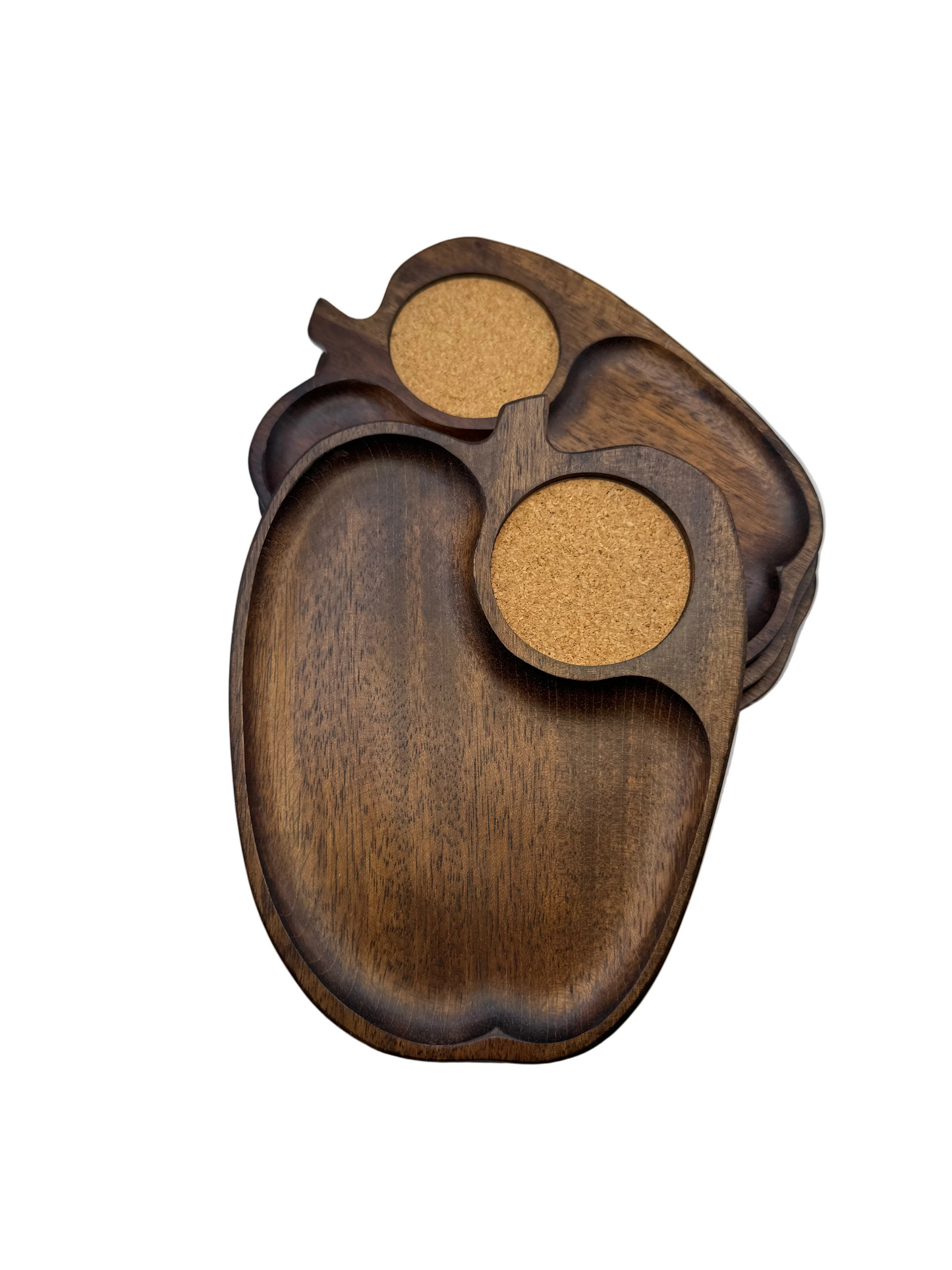 Two apple-shaped wooden snack trays with cork coaster wells shown overlapping