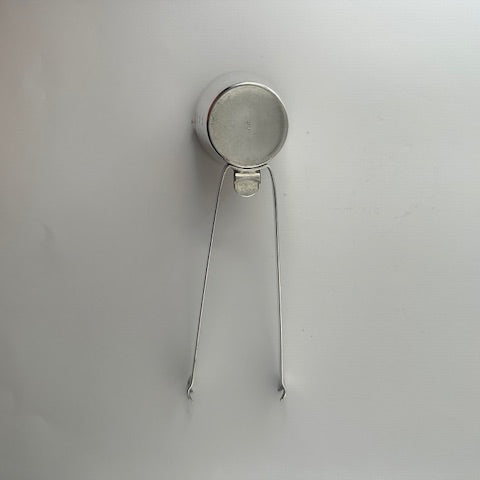 Napier silverplate 4-in-1 bar tool from above, jigger cup with folded ice tongs forming the handle.