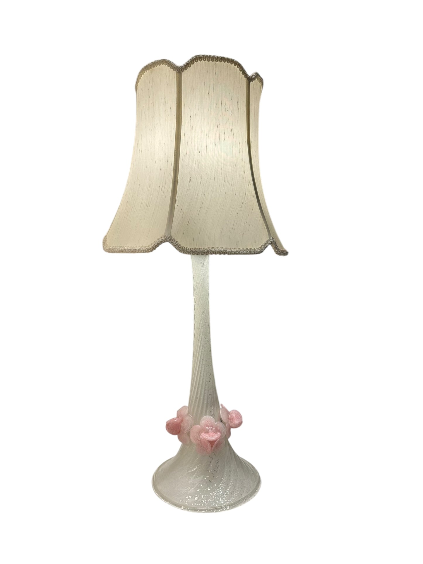 Front view of the white Murano glass floral lamp with cream scalloped bell shade