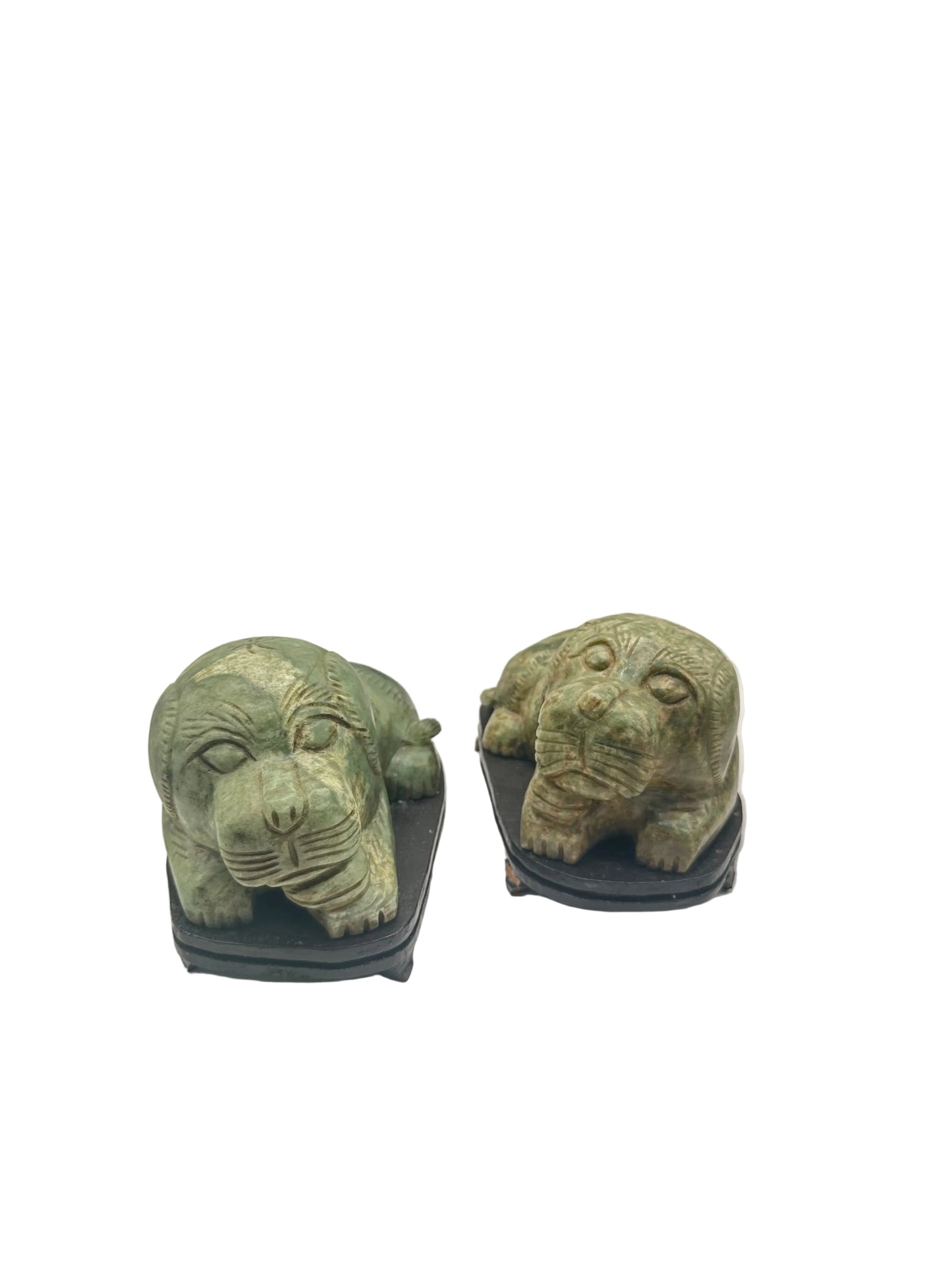 Vintage carved green stone foo dogs, pair facing forward on wood stands