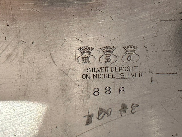 Maker's mark reading 'Silver Deposit on Nickel Silver' with three crowned letters and the number 836