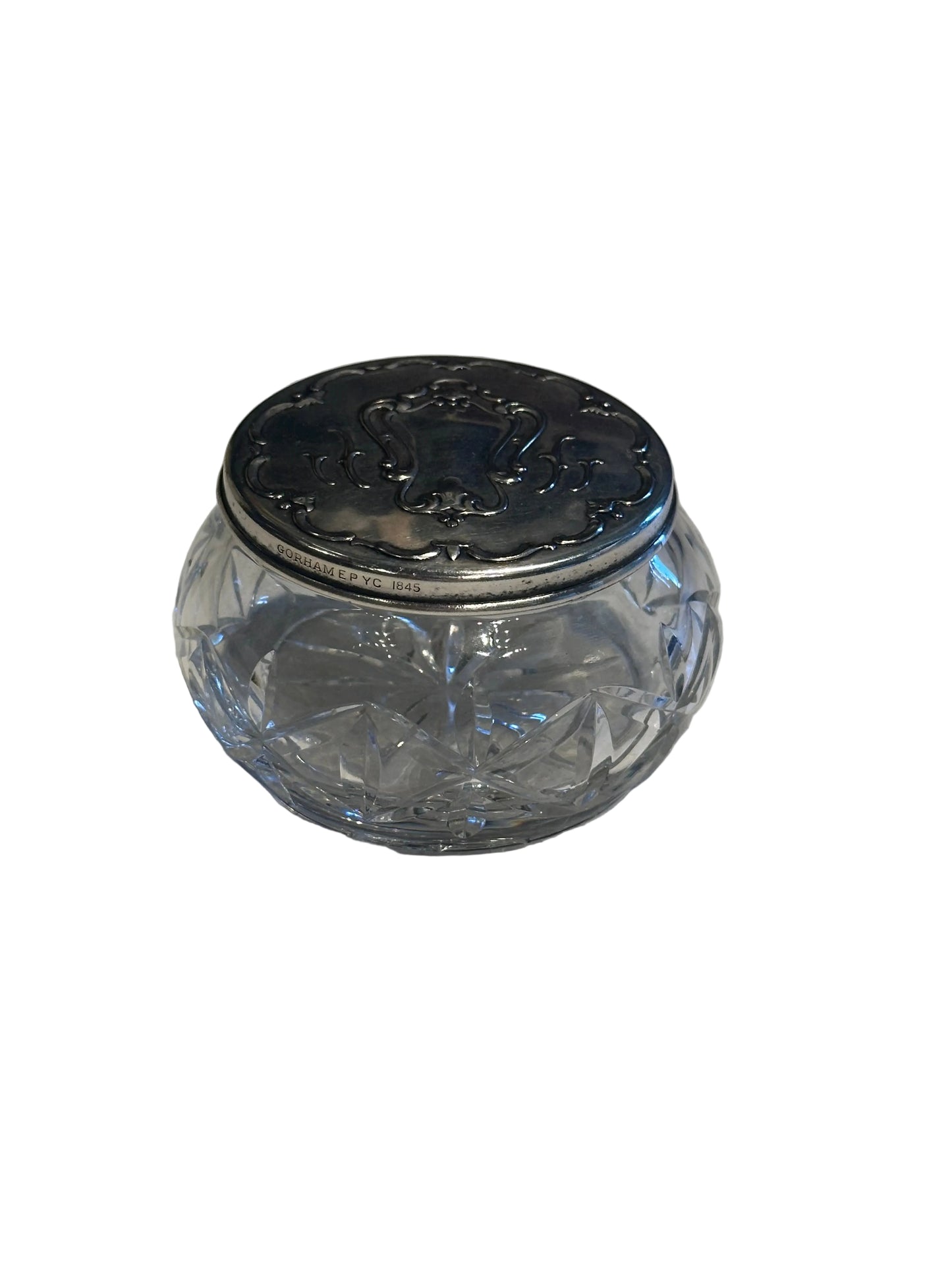 Gorham vintage crystal and silver dresser jar, closed view of the cut glass body and hallmarked silver lid.
