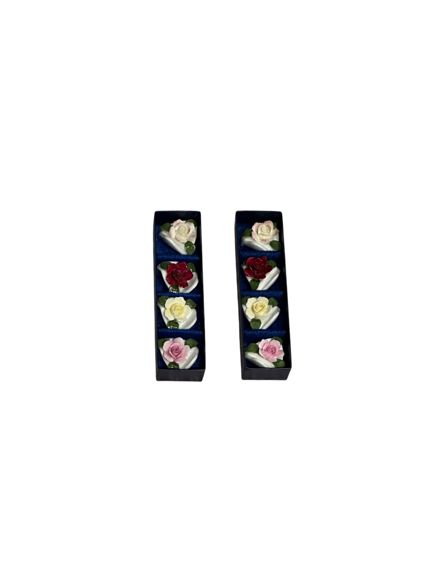 Set of eight porcelain rose place card holders shown in their two original navy boxes