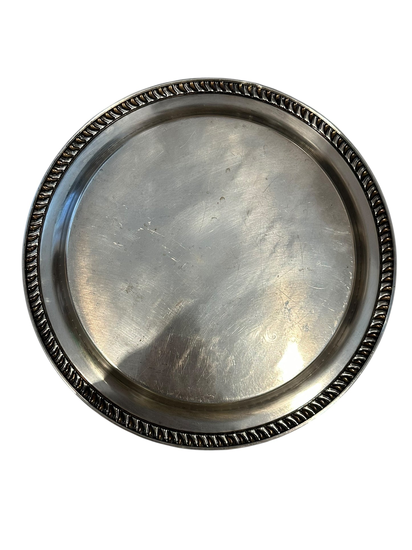 Vintage silver plate round tray with plain center and gadrooned rope rim, showing surface scratches