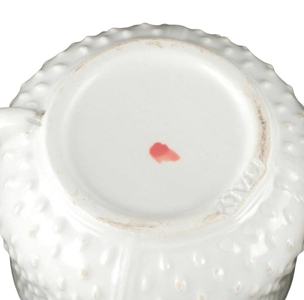 Close-up of Mottahedeh pot de creme underside with red painted maker's mark