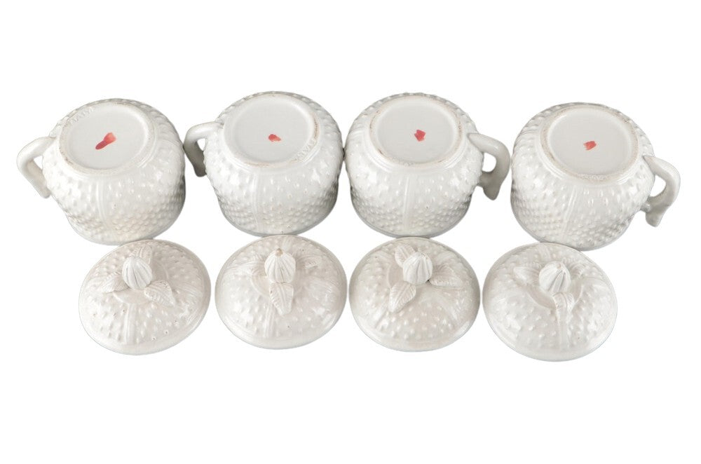 Four Mottahedeh strawberry pots de creme inverted beside lids, showing red maker's mark