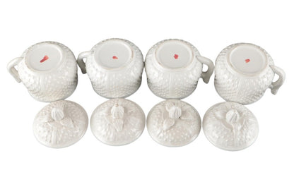Four Mottahedeh strawberry pots de creme inverted beside lids, showing red maker's mark