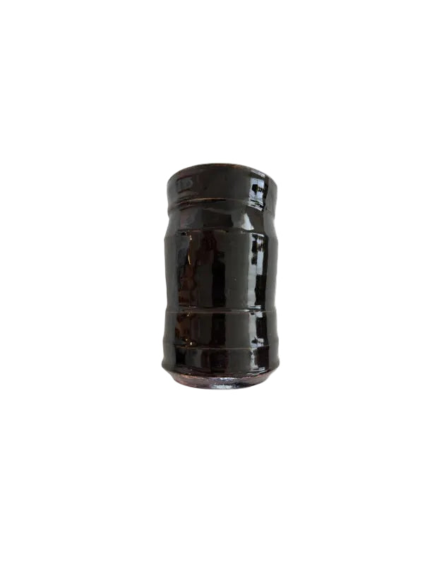 Studio pottery vase with glossy dark brown glaze and a ribbed cylindrical body.