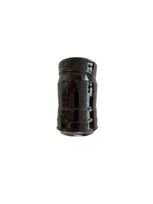 Studio pottery vase with glossy dark brown glaze and a ribbed cylindrical body.