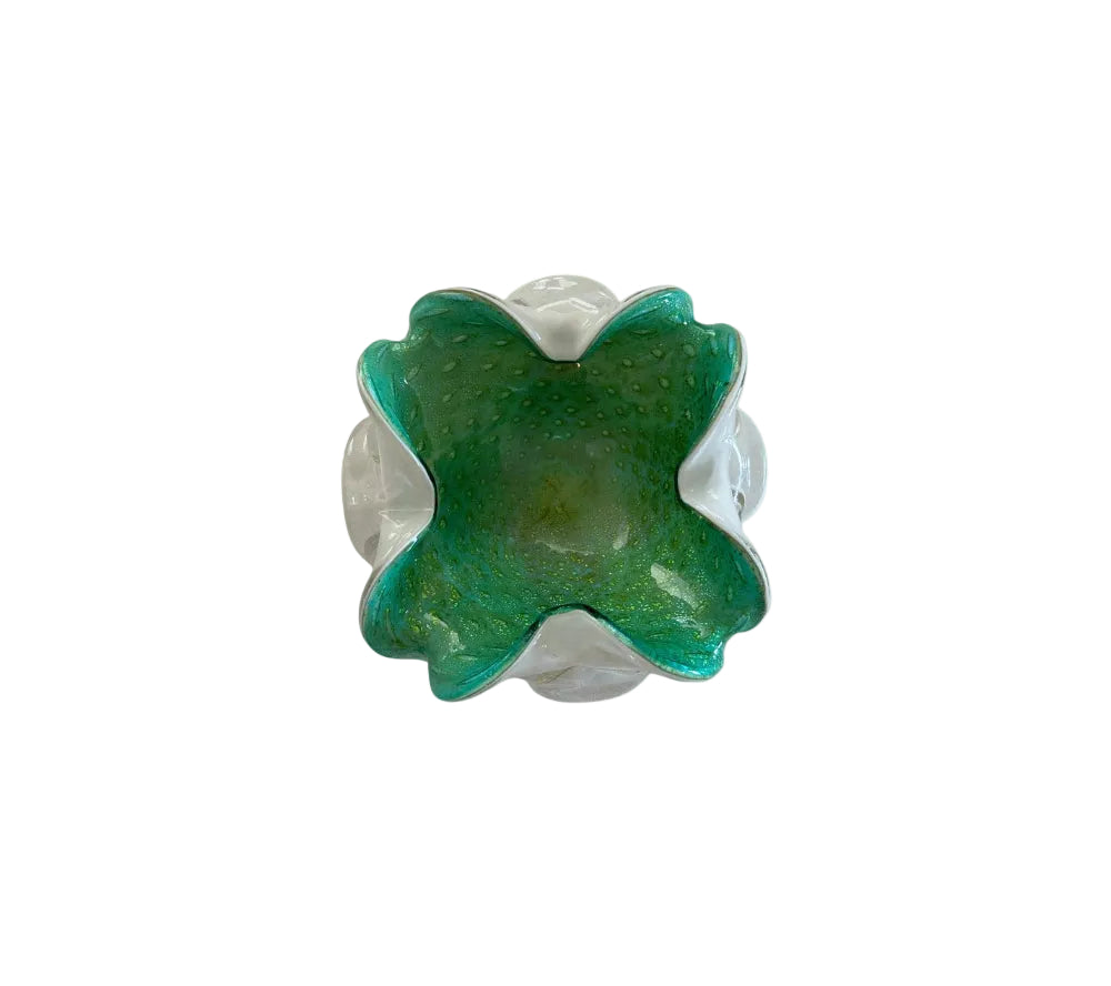 Green Murano glass dish with bubbled interior and clear scalloped sides, angled front view