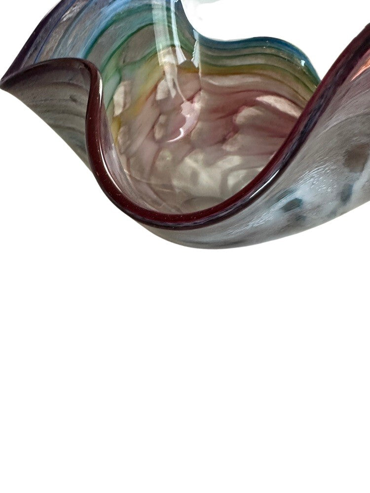 Close-up of the wavy ruffled rim of the Murano style rainbow handblown glass bowl