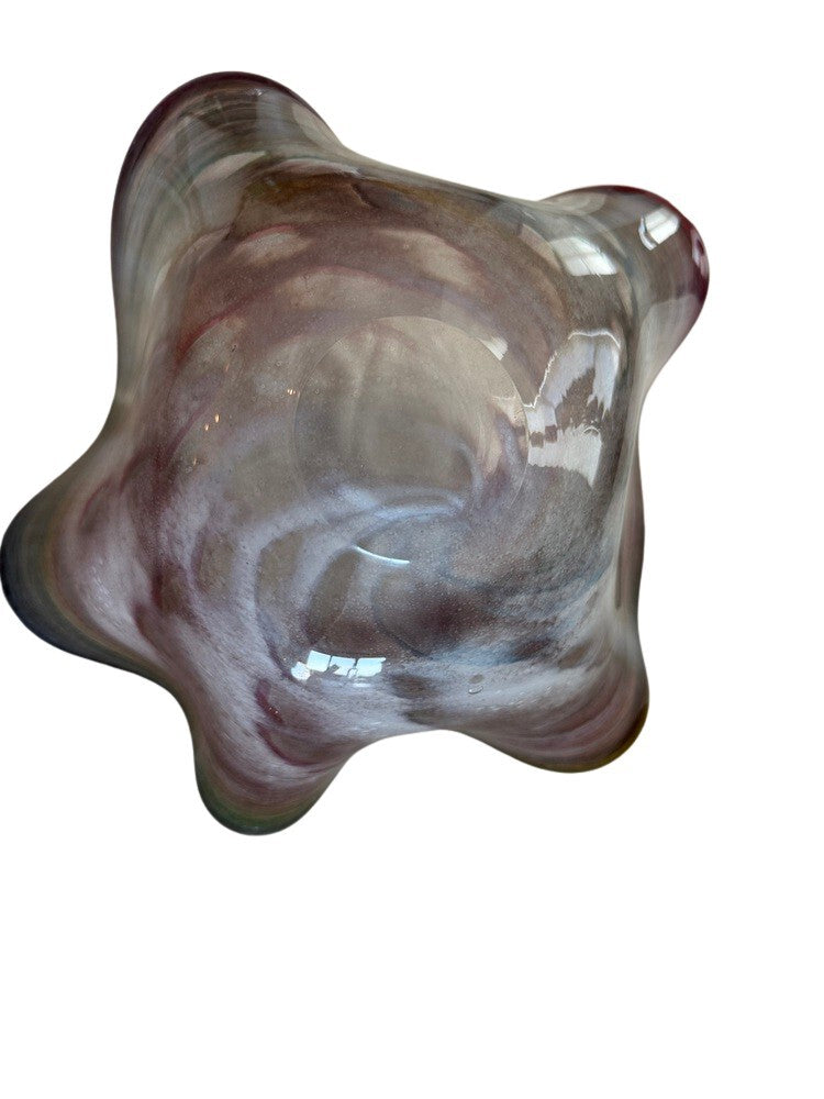 Murano style rainbow handblown glass bowl underside, showing pale swirled glass and freeform edges