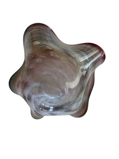 Murano style rainbow handblown glass bowl viewed from the base, showing the freeform shape