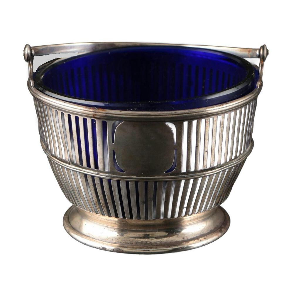 Vintage sterling silver sugar basket, pierced body with cobalt blue glass liner and swing handle