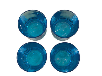 Top-down view of four blue sailor glasses showing their tinted interiors and rounded bases.