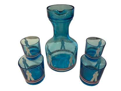Blue sailor-motif carafe set with four striped tumblers arranged around it.