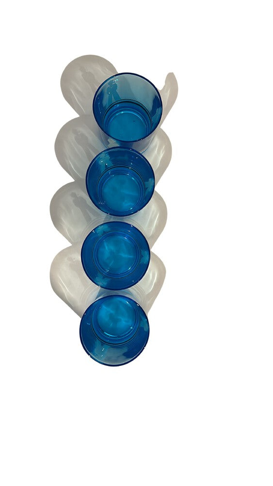 Four blue sailor glasses lined up diagonally, viewed from above showing rims and bases.
