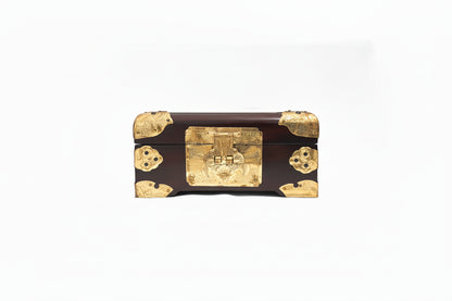 Vintage Asian dark wood box, front view with engraved brass clasp and corner mounts