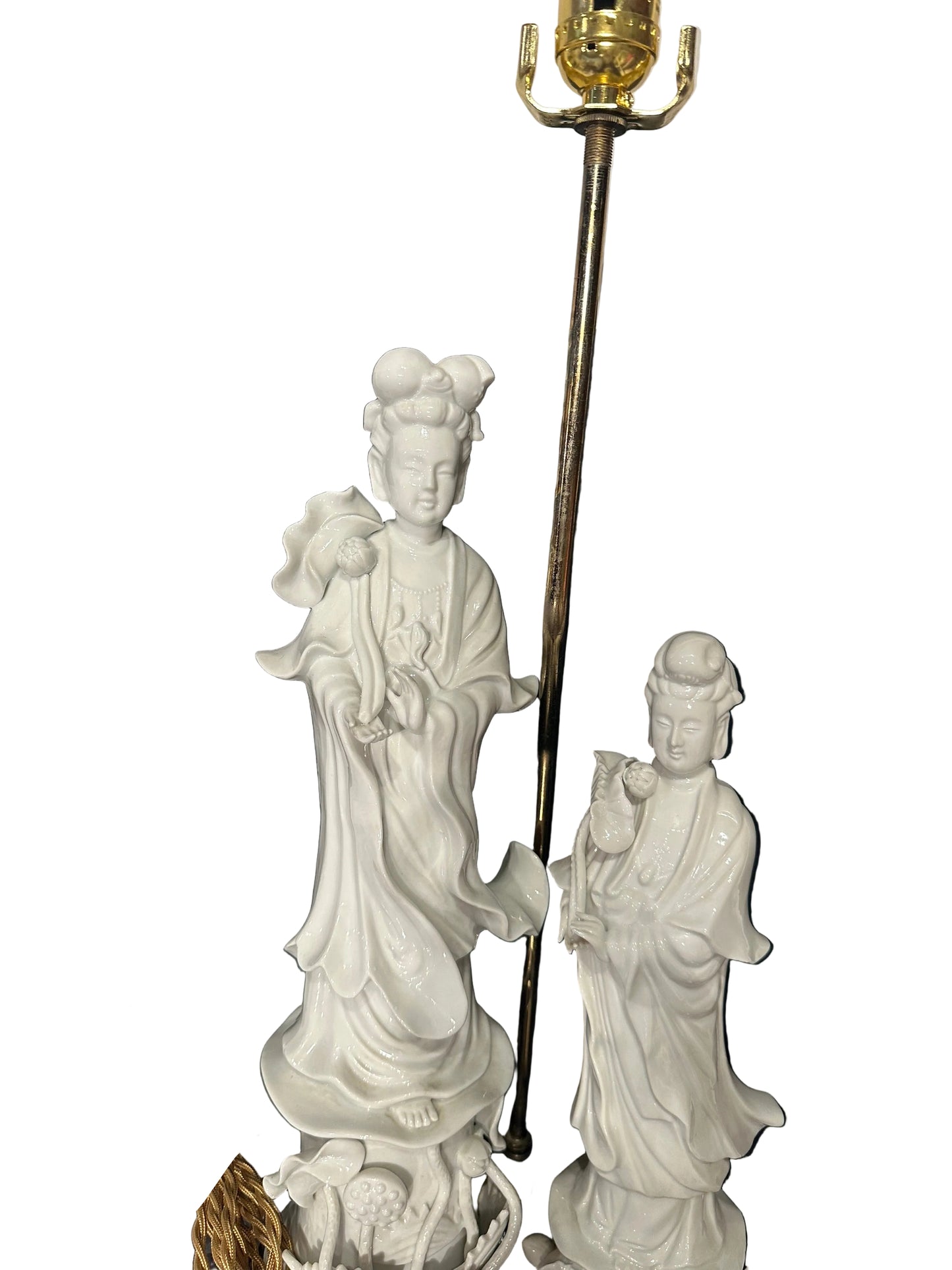 Two white blanc de Chine porcelain figures on the table lamp, detail of flowing robes and brass stem