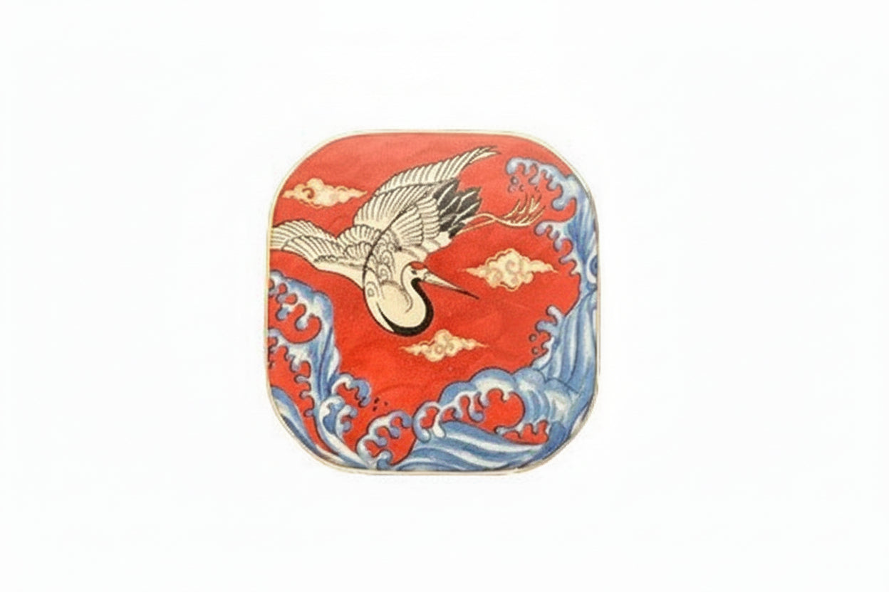 Vintage porcelain small box, lid top: flying white crane over red ground with blue waves and gold clouds.