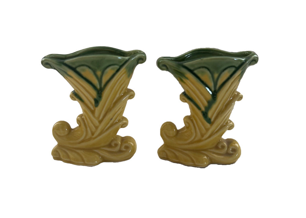 Pair of vintage Shawnee Pottery vases, yellow-and-green glazed cornucopia form with leaf motifs, front view