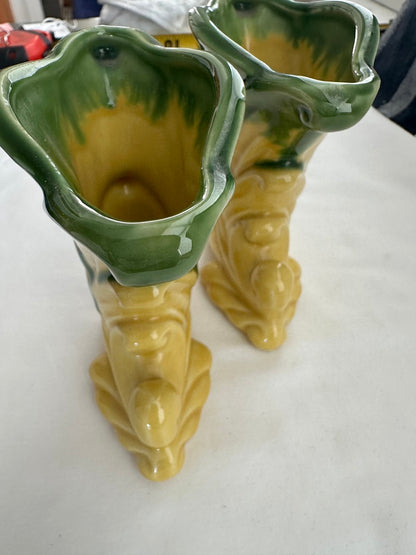 Pair of vintage Shawnee Pottery cornucopia vases viewed from above, green-and-yellow flared openings