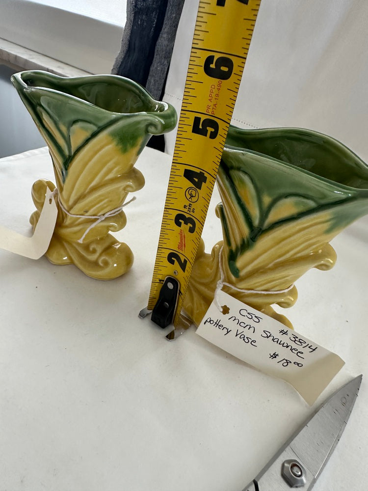 Vintage Shawnee Pottery vase beside a tape measure reading about 6 inches tall, with handwritten tag