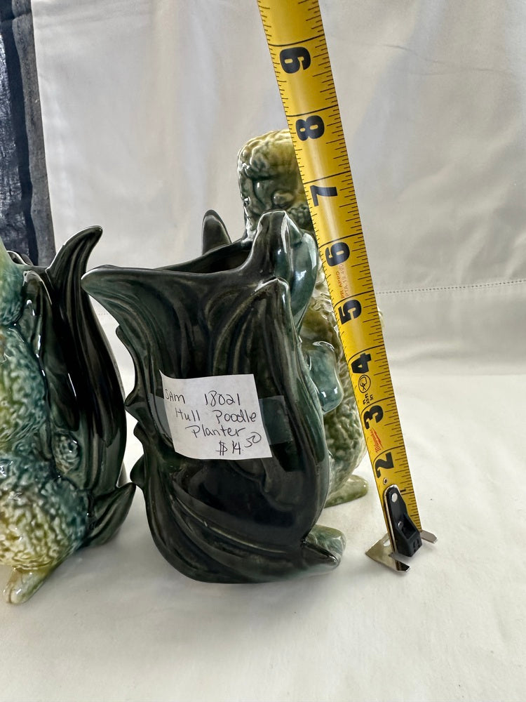 Vintage Hull poodle vase beside a tape measure reading about 8.5 inches tall, with handwritten price tag