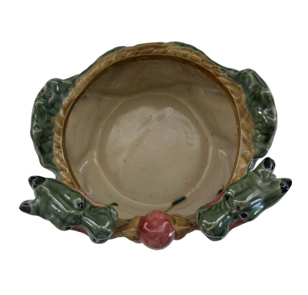 Top view into the ceramic double dragon planter bowl with two green dragon heads and pink pearl