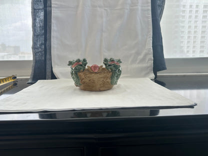 Ceramic double dragon planter on a windowsill table with city view, two dragon heads and pink pearl