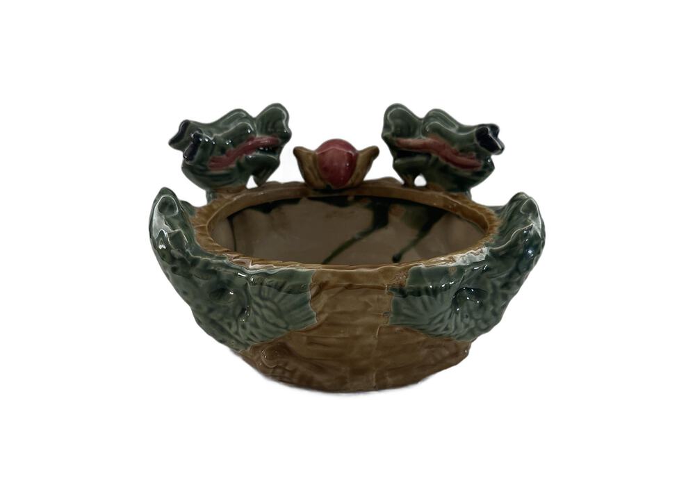 Front view of the ceramic double dragon planter showing the open bowl and two dragon-head handles