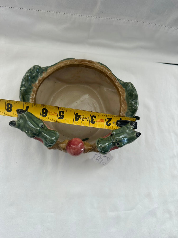 Ceramic double dragon planter measured with a tape, about 6 inches across, viewed from above