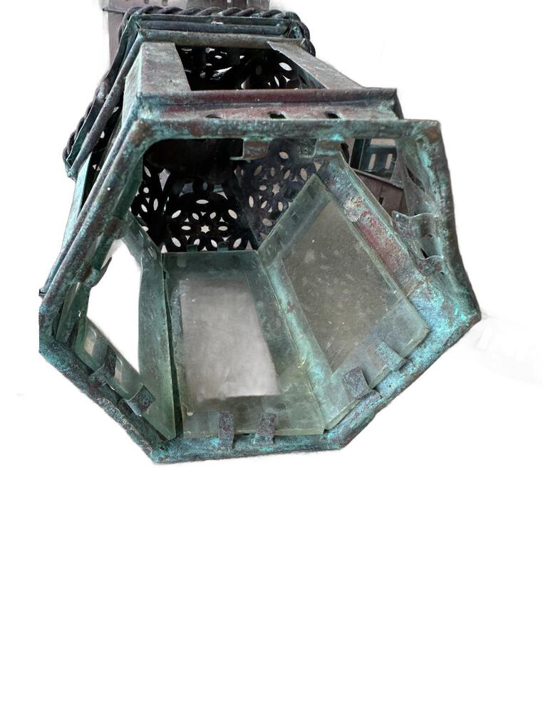 Vintage copper lantern, close-up of the underside and glass-panel sides of one lantern