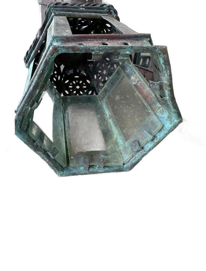 Vintage copper lantern, close-up of the underside and glass-panel sides of one lantern