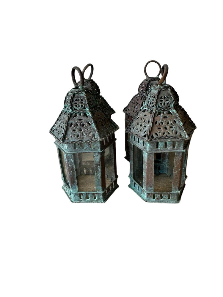 Vintage copper lanterns, two small lanterns side by side showing glass panels and green patina