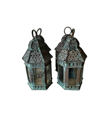 Vintage copper lanterns, two small lanterns side by side showing glass panels and green patina
