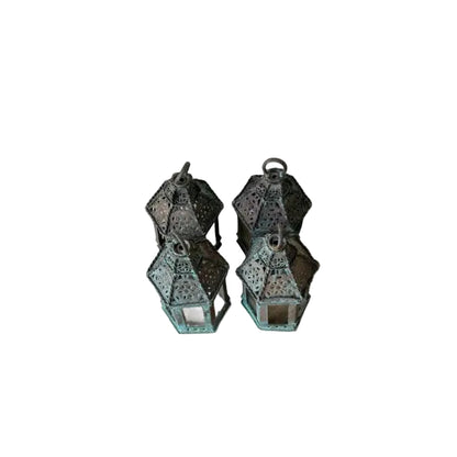Vintage copper lanterns, rear view of grouped lanterns showing pierced backs and green patina