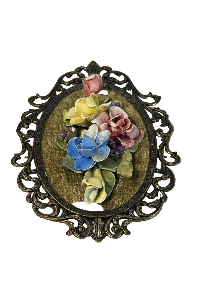 Capodimonte porcelain flower cluster of pink, blue and yellow roses raised on green velvet in ornate gilt frame