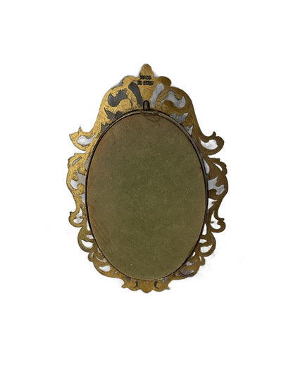 Back of Capodimonte plaque showing gilt openwork frame, wire hanging loop and 'Made in Italy' stamp