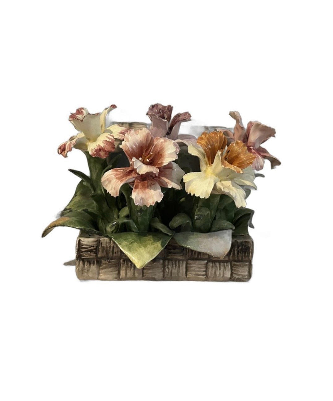 Vintage Capodimonte porcelain flower arrangement in a woven-basket base, front view of multicolored blooms