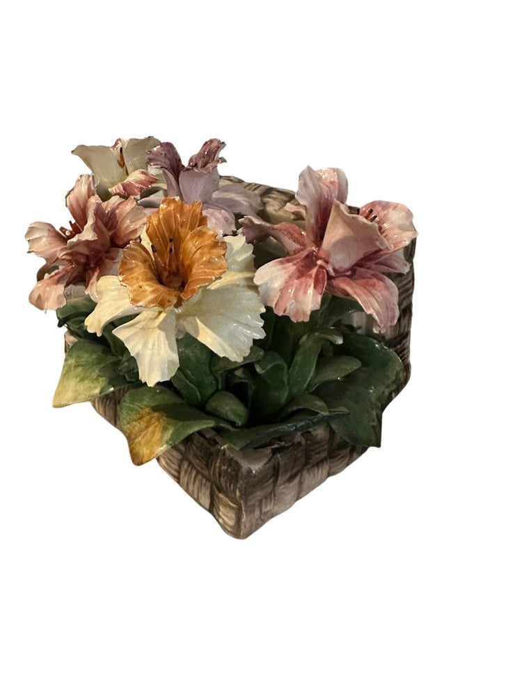 Top-down view into the Capodimonte porcelain basket of multicolored flowers