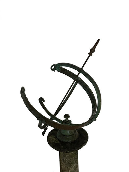 Close-up of the bronze armillary sphere, verdigris rings and central arrow gnomon, mounted on its base