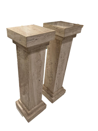 Pair of MCM limestone pedestals viewed from above at an angle, square tops and tapered shafts.