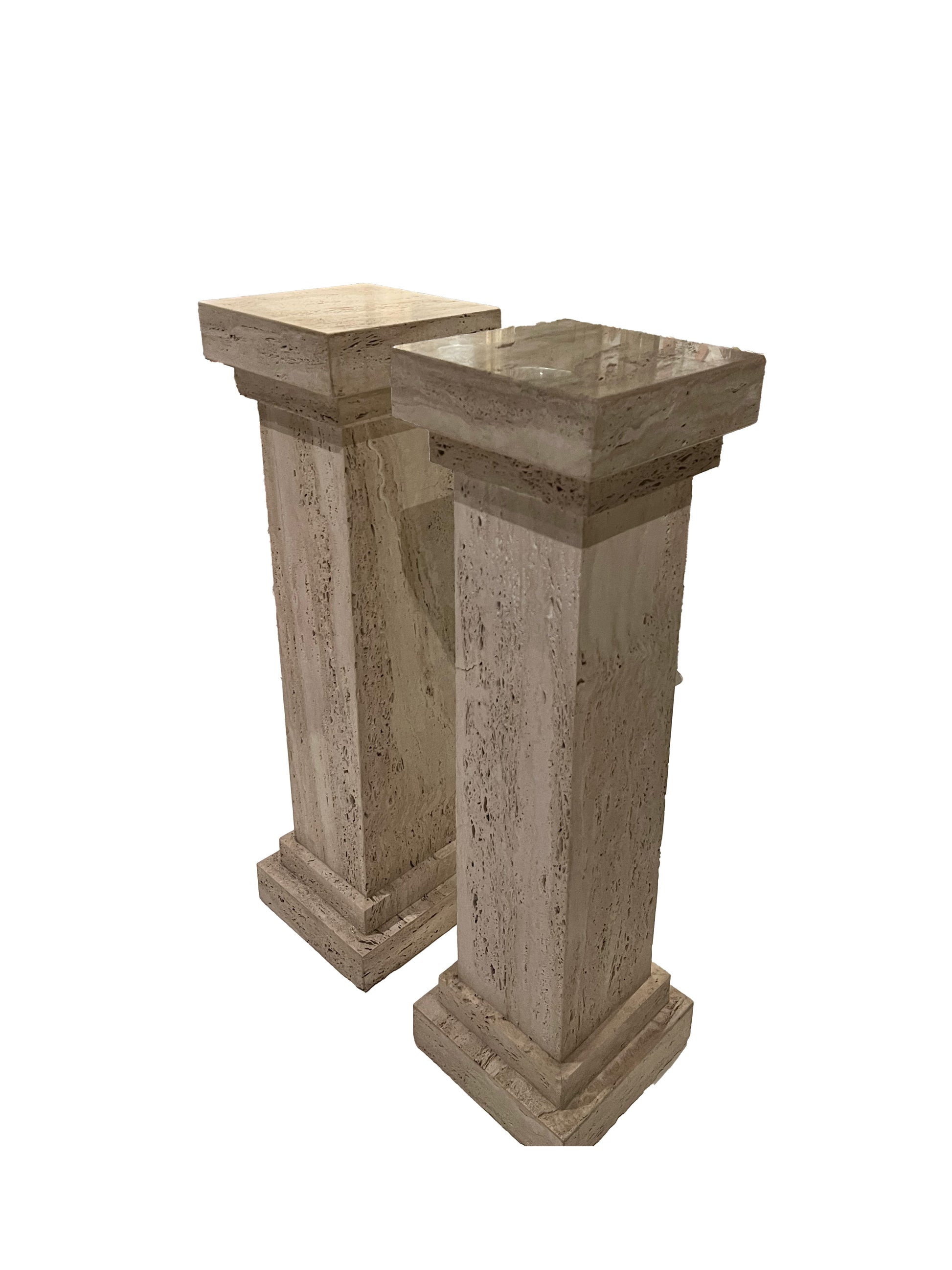 Pair of MCM limestone pedestals at an angle showing square tops and tapered columns.