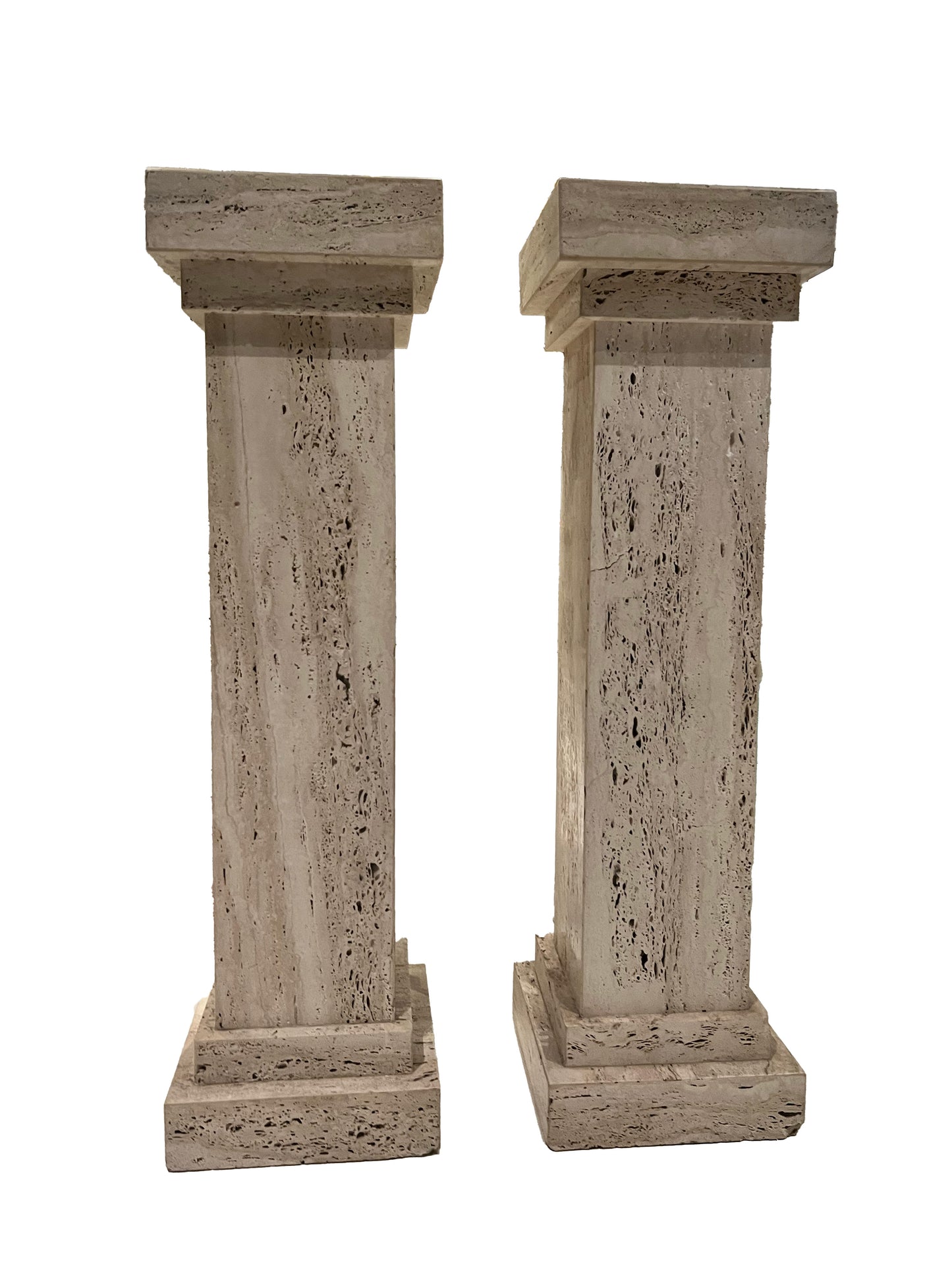 Pair of MCM travertine limestone pedestals, front view of clean-lined square columns.